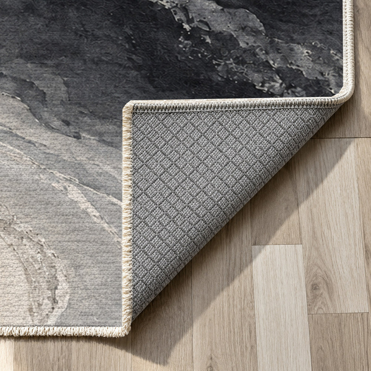 Coastal Contours Charcoal Abstract Washable Rug — backing close up