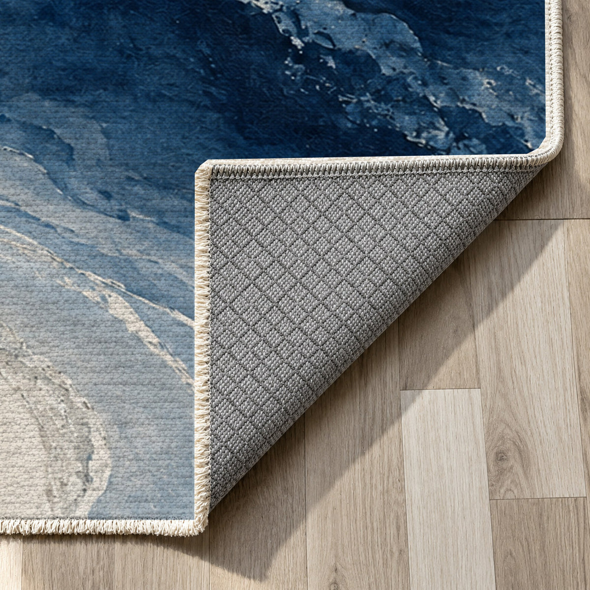 Coastal Contours Indigo Abstract Washable Rug — backing close up