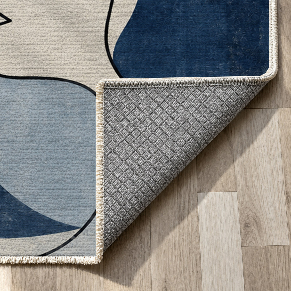Conversation Indigo Abstract Washable Rug — backing close up