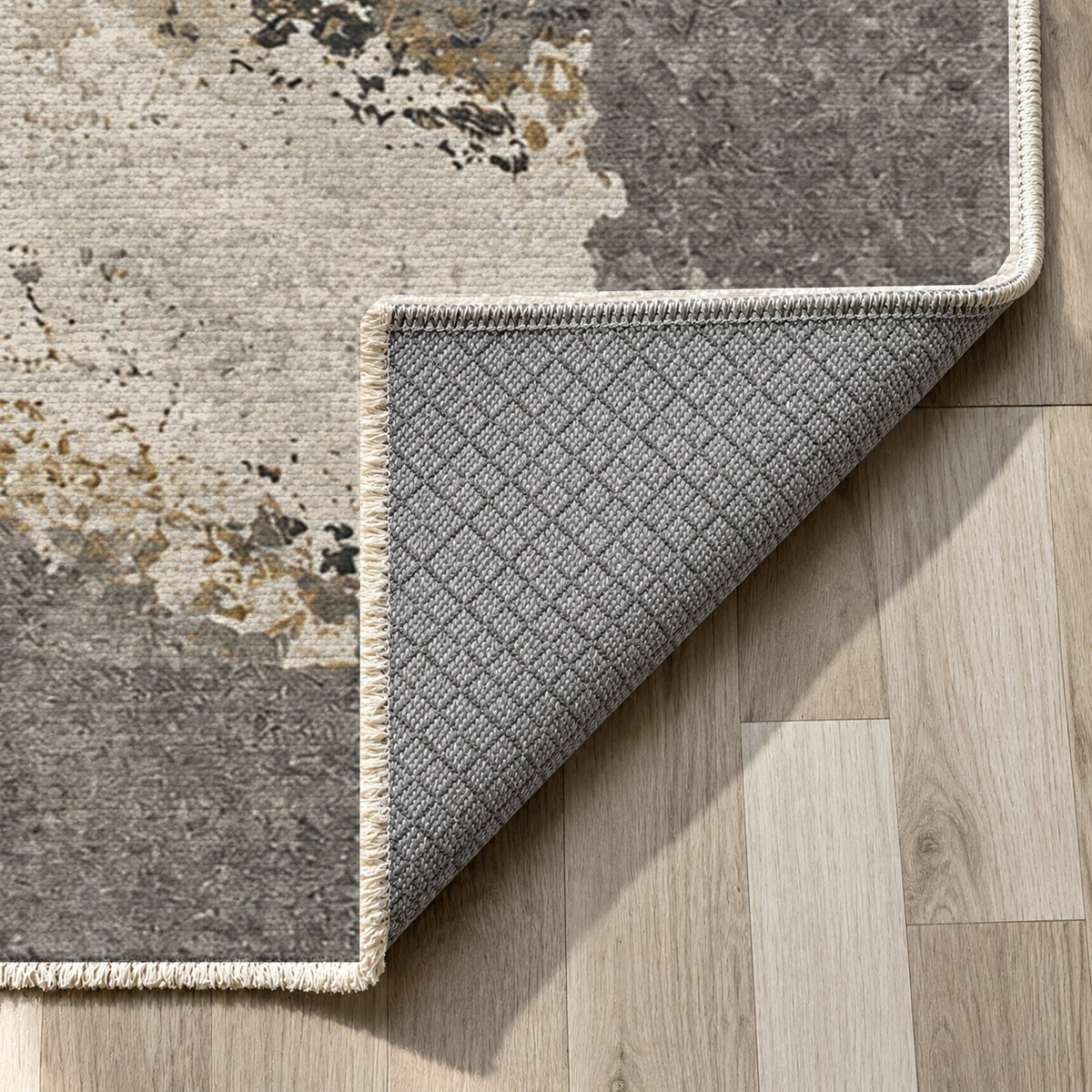 Earth Pigment Charcoal Gold Abstract Washable Rug — backing close up