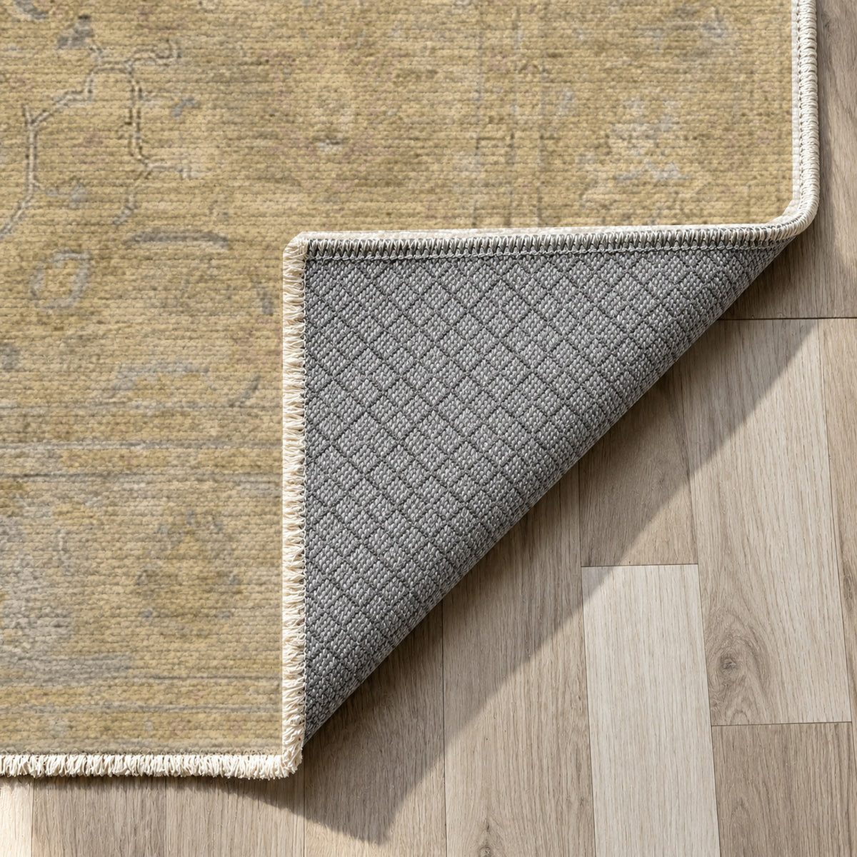 Faded Bloom Muted Gold Vintage Washable Rug — backing close up