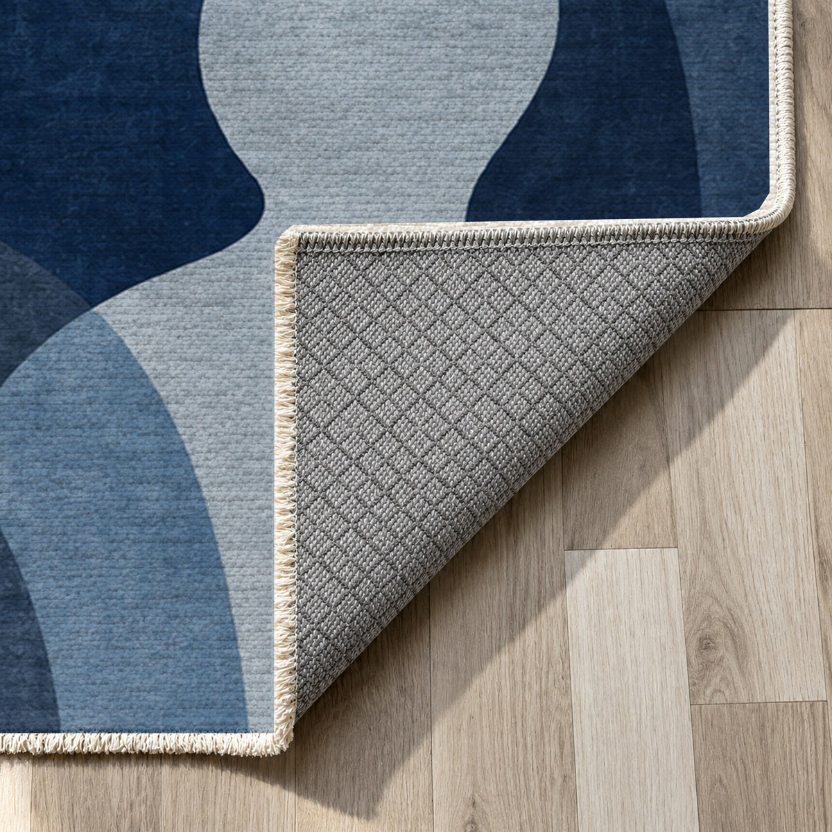 Gathering Shapes Indigo Abstract Washable Rug — backing close up