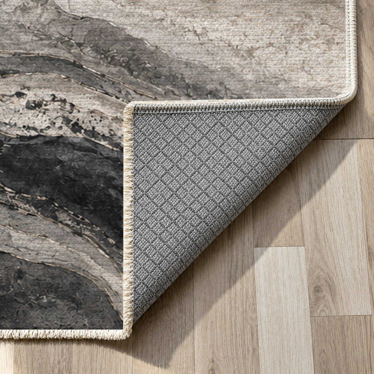 Geological Layers Charcoal Abstract Washable Rug — backing close up