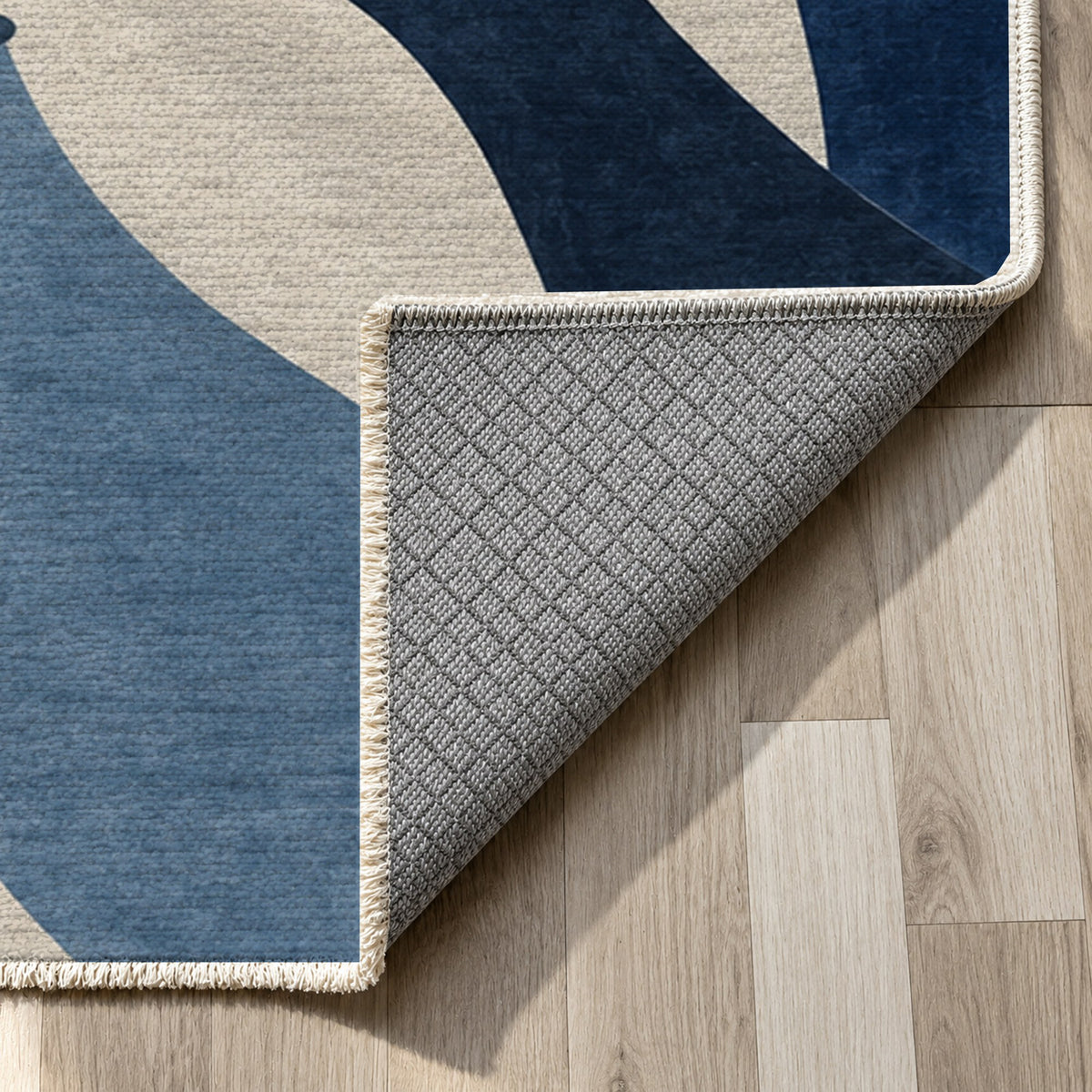 Hands In Harmony Indigo Abstract Washable Rug — backing close up