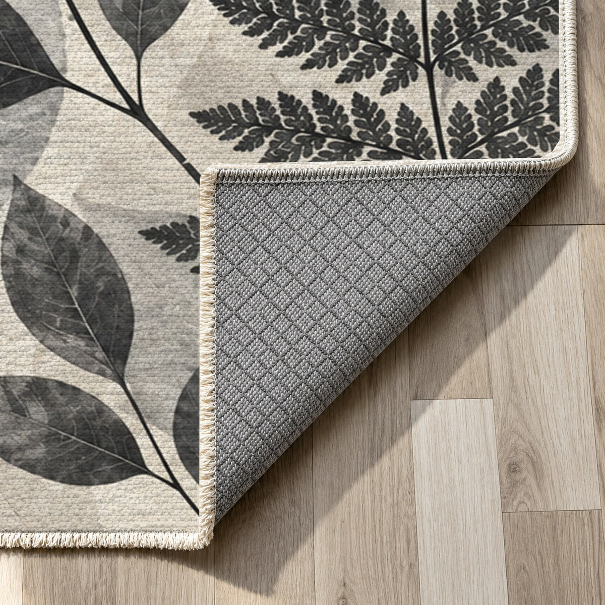 Leaf Impressions Charcoal Floral Washable Rug — backing close up