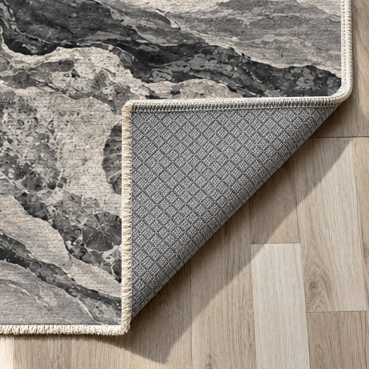 Limestone Fossils Charcoal Abstract Washable Rug — backing close up