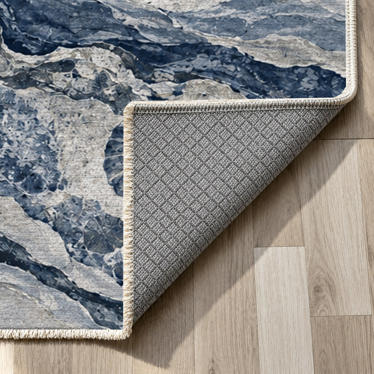 Limestone Fossils Indigo Abstract Washable Rug — backing close up