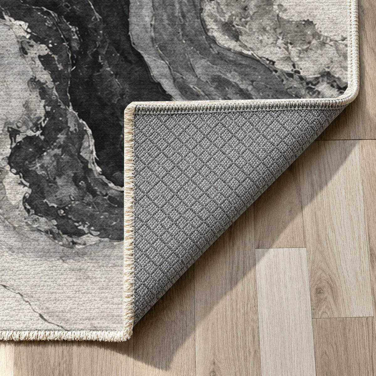 Marble Veins Charcoal Abstract Washable Rug — backing close up