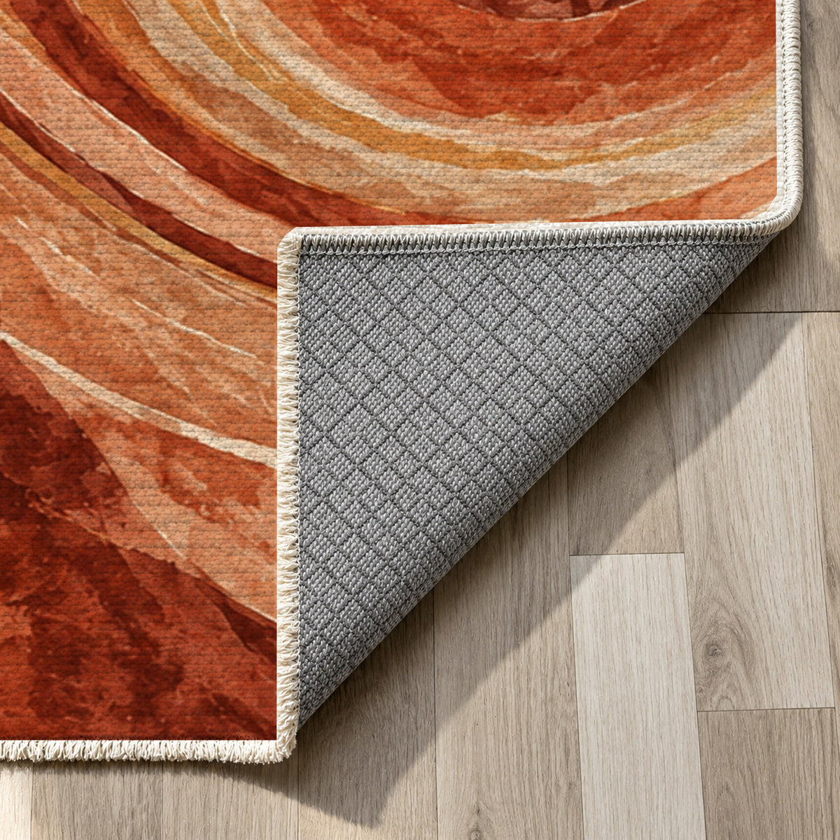 Ocean Rings Terracotta Abstract Washable Rug — backing close up