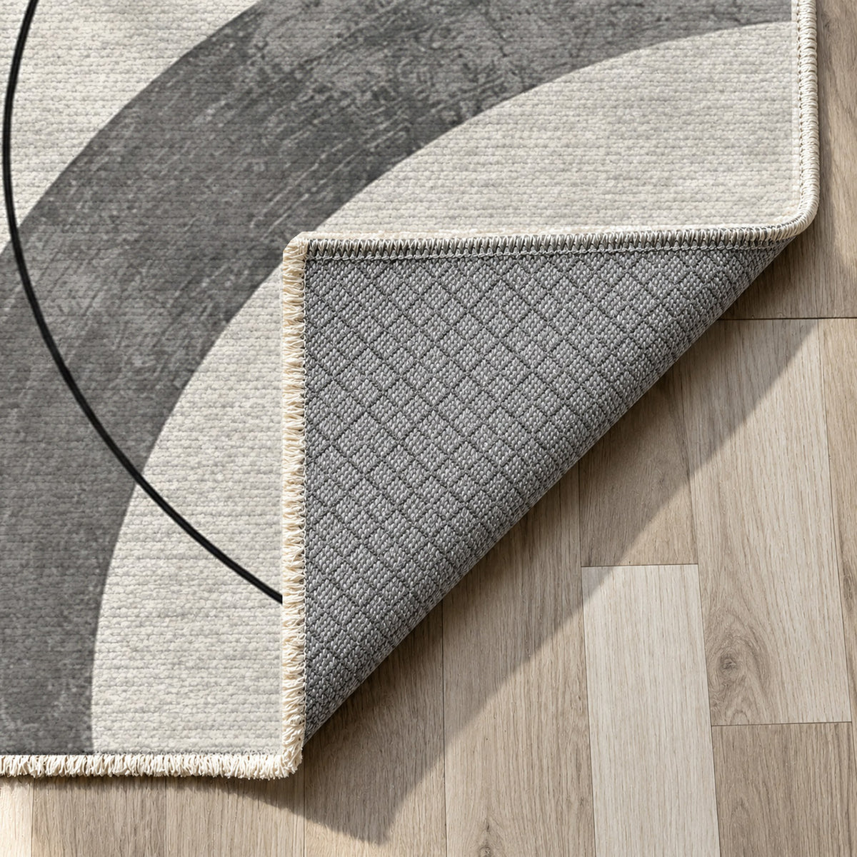 Orbit Rhythm Charcoal Ivory Modern Washable Rug — backing close up