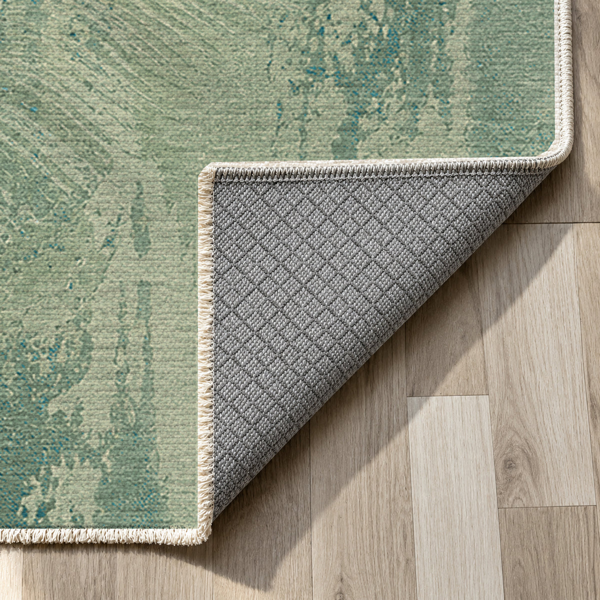 Pampas Aqua Abstract Washable Rug — backing close up