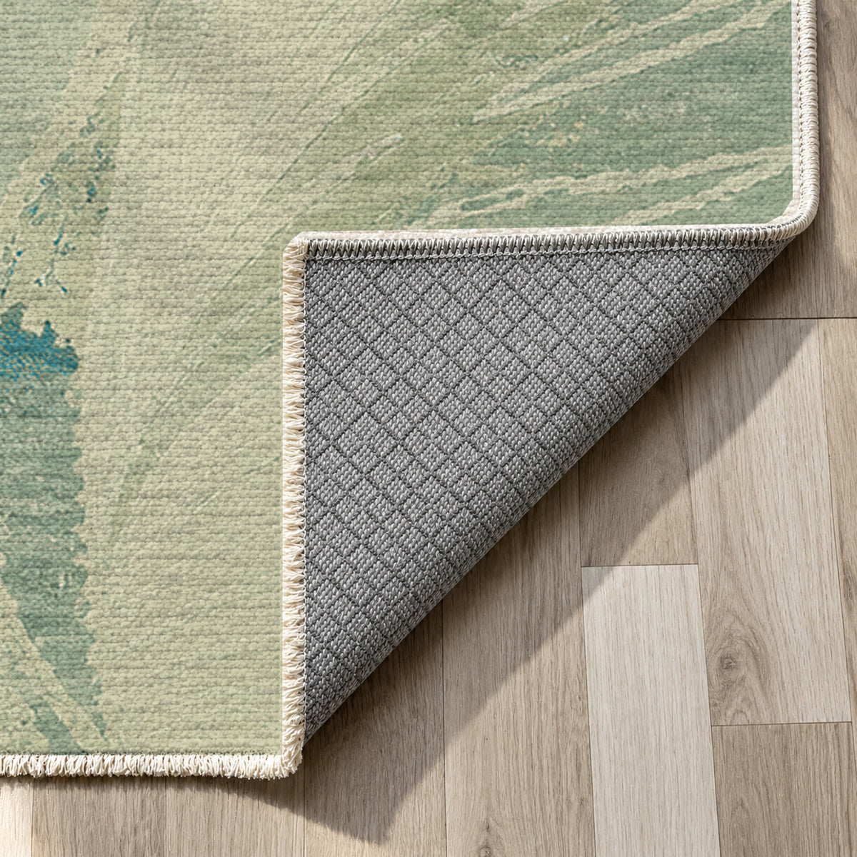 Plume Aqua Abstract Washable Rug — backing close up