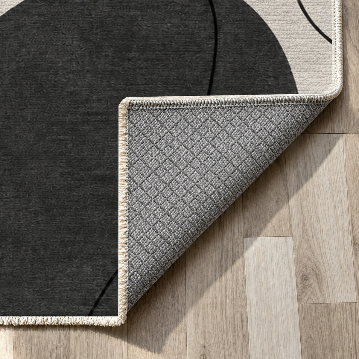 Quiet Profiles Charcoal Abstract Washable Rug — backing close up