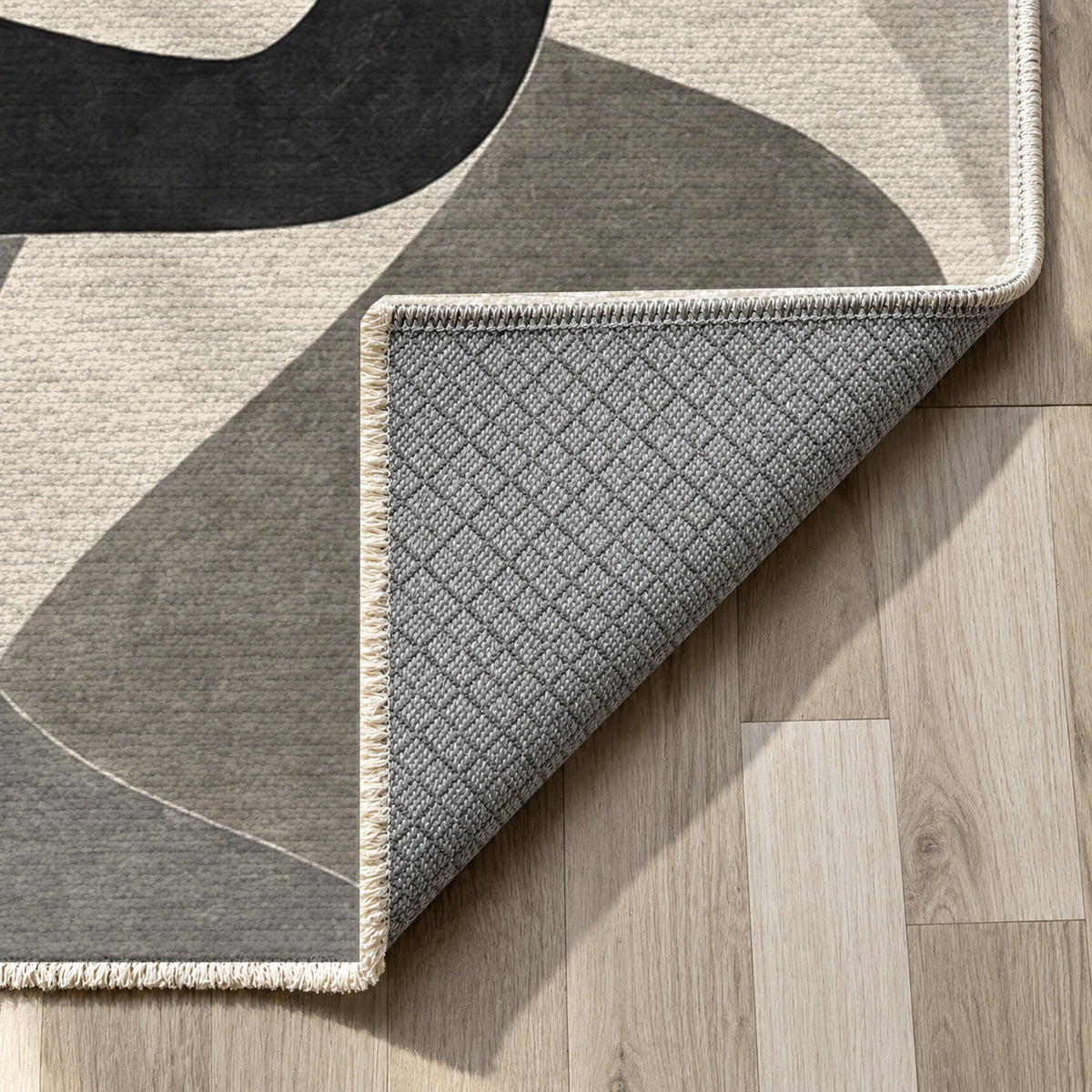Shared Gestures Charcoal Abstract Washable Rug — backing close up
