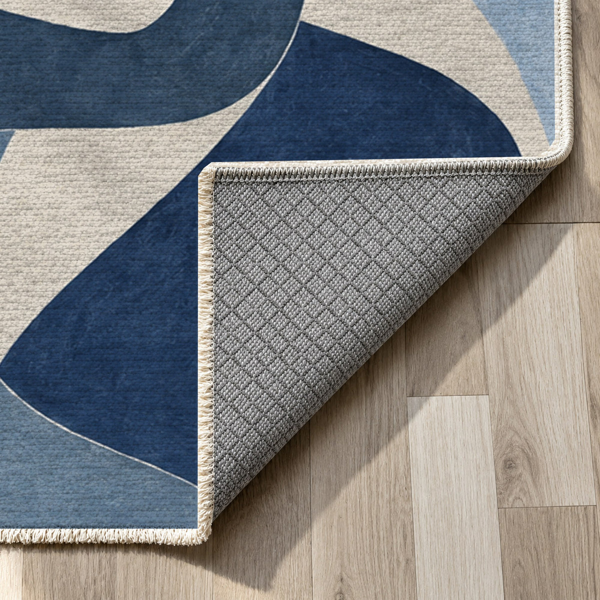 Shared Gestures Indigo Abstract Washable Rug — backing close up