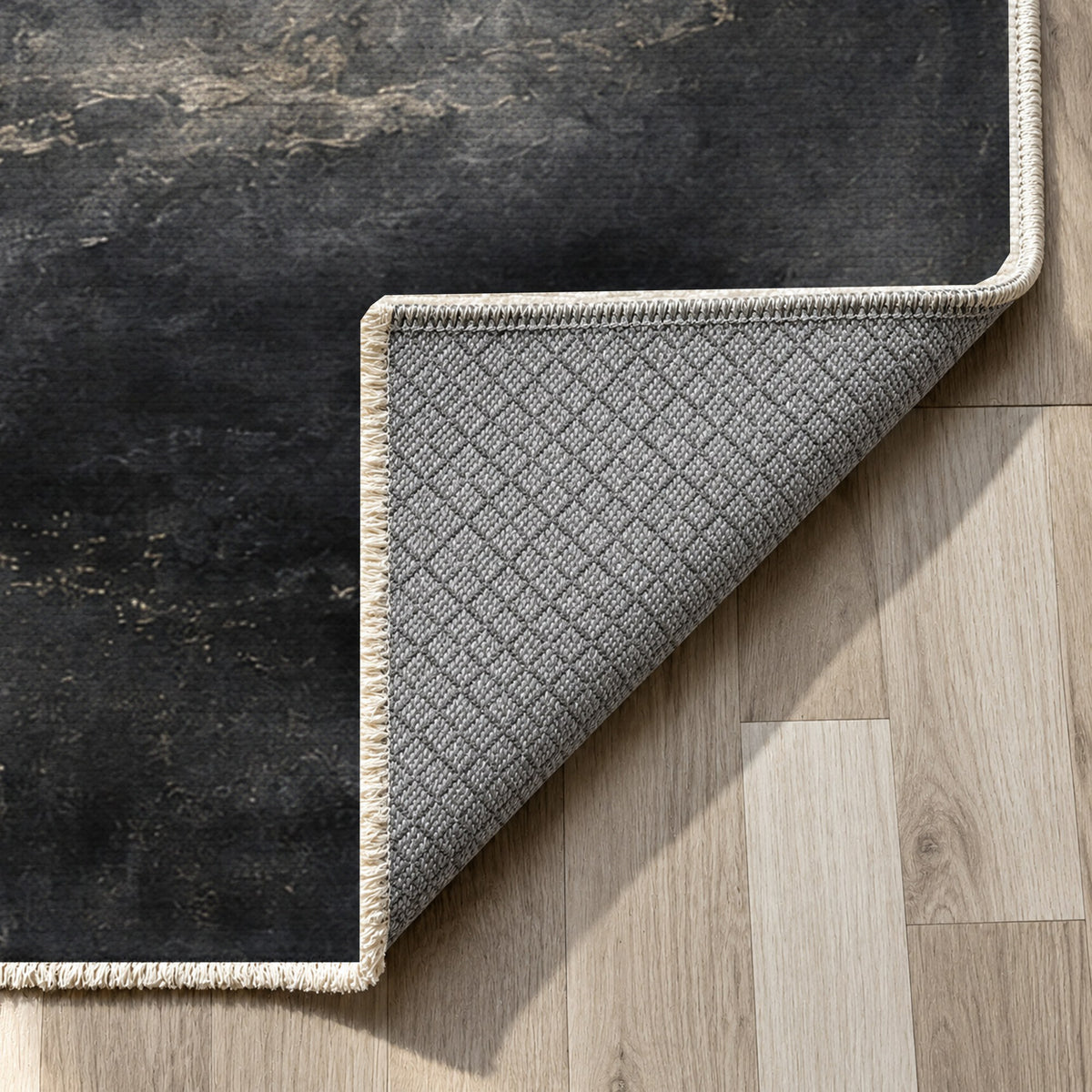 Solar Halo Charcoal Abstract Washable Rug — backing close up