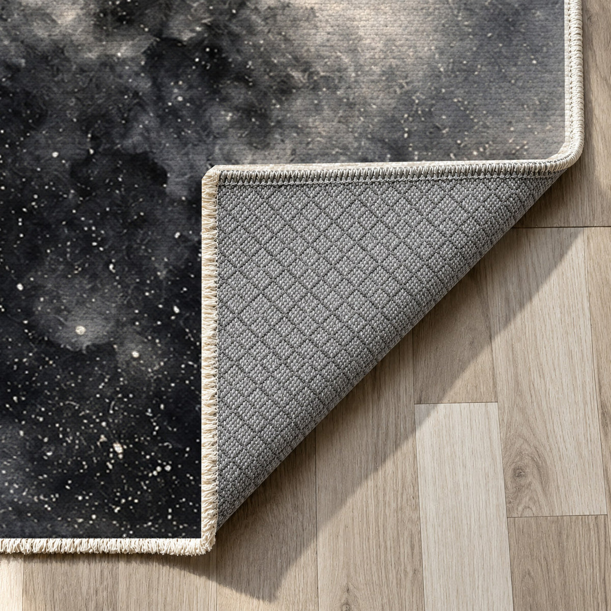 Stellar Dust Charcoal Abstract Washable Rug — backing close up