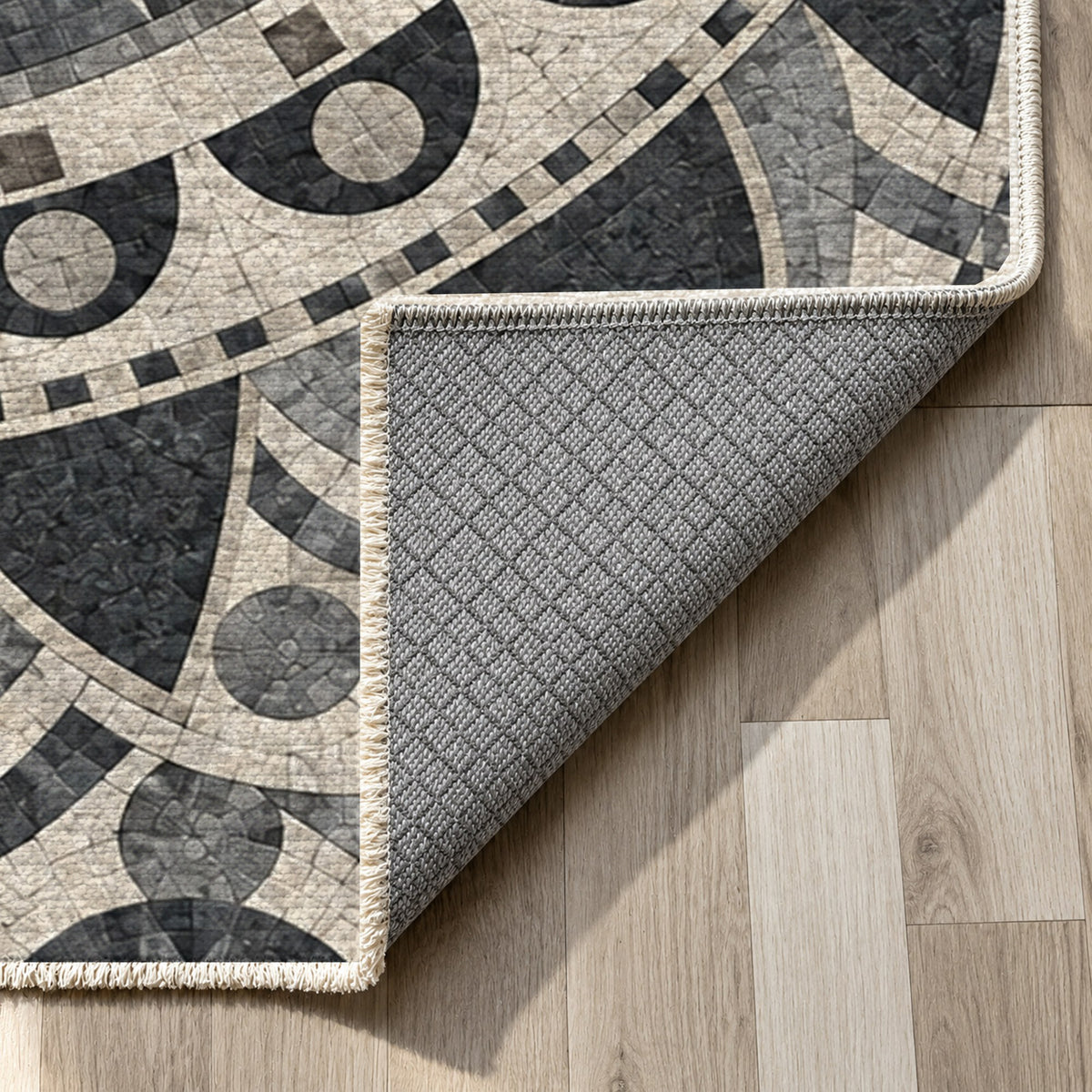 Sun Wheel Charcoal Geometric Washable Rug — backing close up