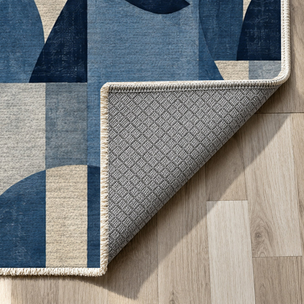 Urban Faces Indigo Abstract Washable Rug — backing close up