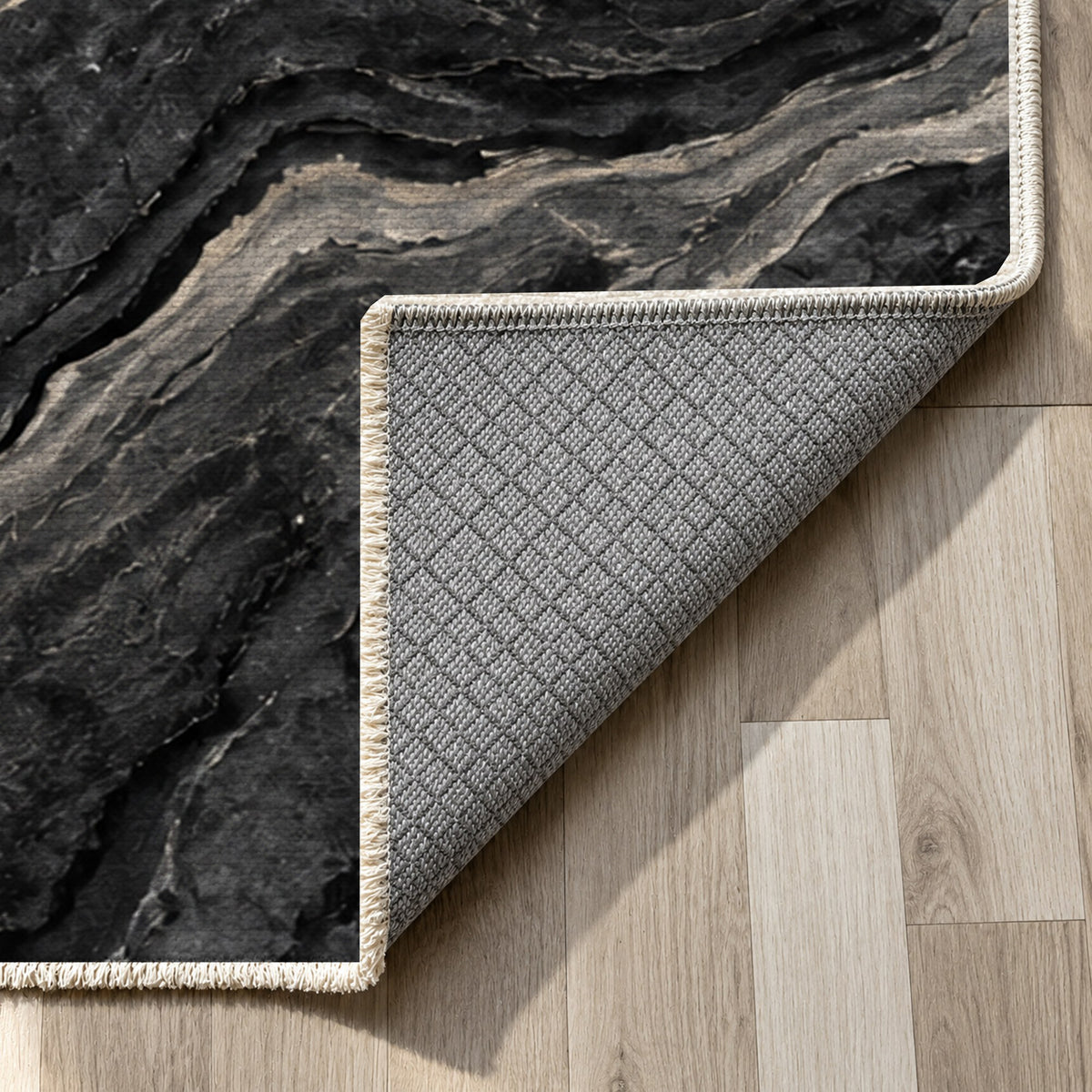 Volcanic Flow Charcoal Abstract Washable Rug — backing close up